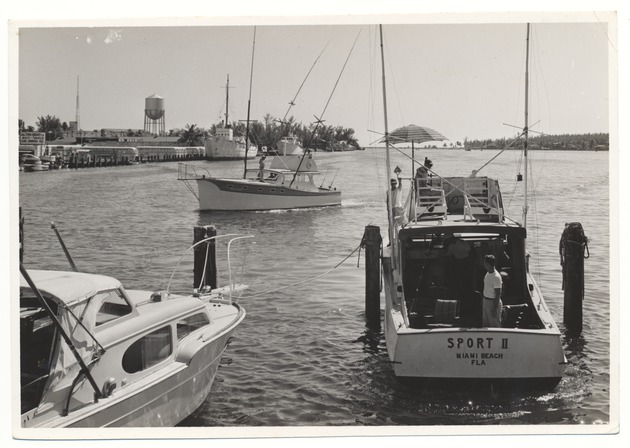 Boats leaving the docks, including the "Sport II"