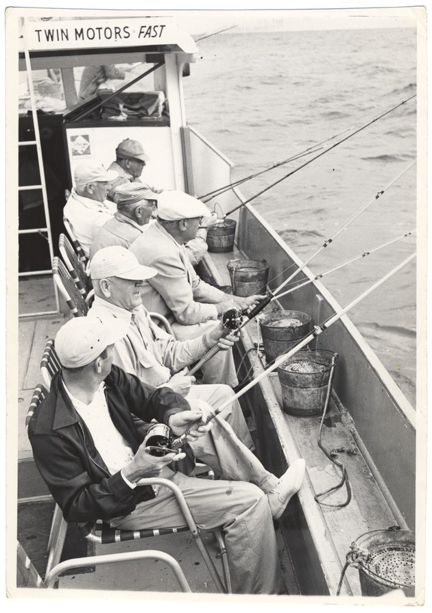 Men drift fishing