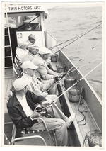 Men drift fishing