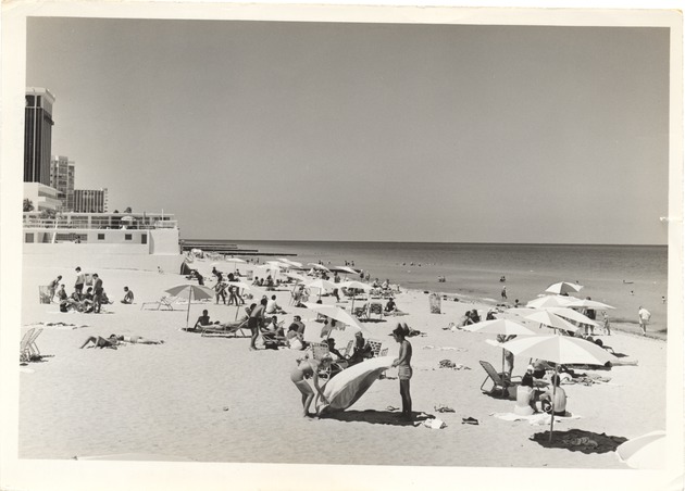 North of the Fontainebleau, showing people sunbathing and swimming and the Doral Hotel at extreme left - 