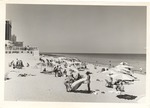 North of the Fontainebleau, showing people sunbathing and swimming and the Doral Hotel at extreme left