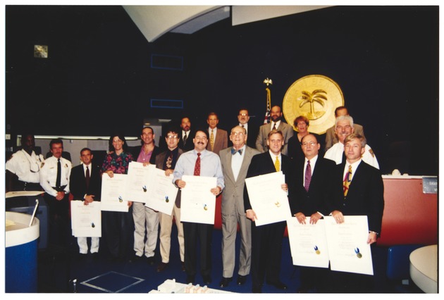 Chief of Police Richard Barreto and officers receiving certificates of appreciation from Mayor Seymour Gelber, 1997 - Photograph, recto: [Mayor Seymour Gelber presents certificates of appreciation to police officers, February 1, 1997].