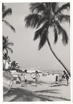 Beach scene with a hotel pool in the background, February 1960