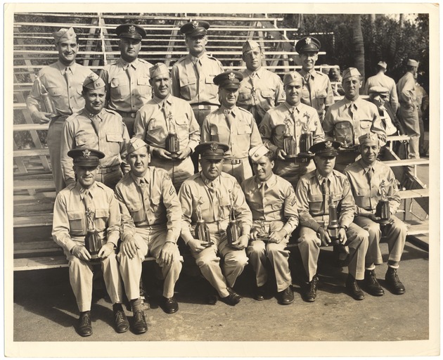 Army Air Forces Squadron 581 at Miami Beach - Photograph, recto: [Squadron 581 displaying trophies won in competition, 1944-1945]