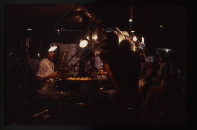 Night scene of people at a food truck