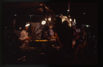 Night scene of people at a food truck