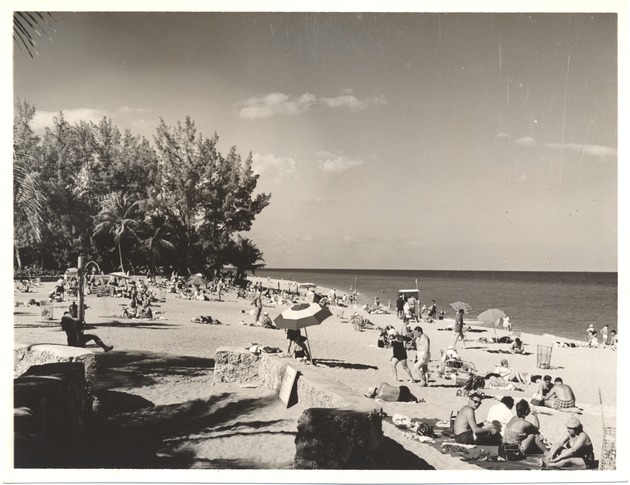 Beach scenes, sunbathers, and hotels from Lummus Park to 15th Street, 1953-1956 - Photograph, recto: [Beach scene, Lummus Park, June 1956]
