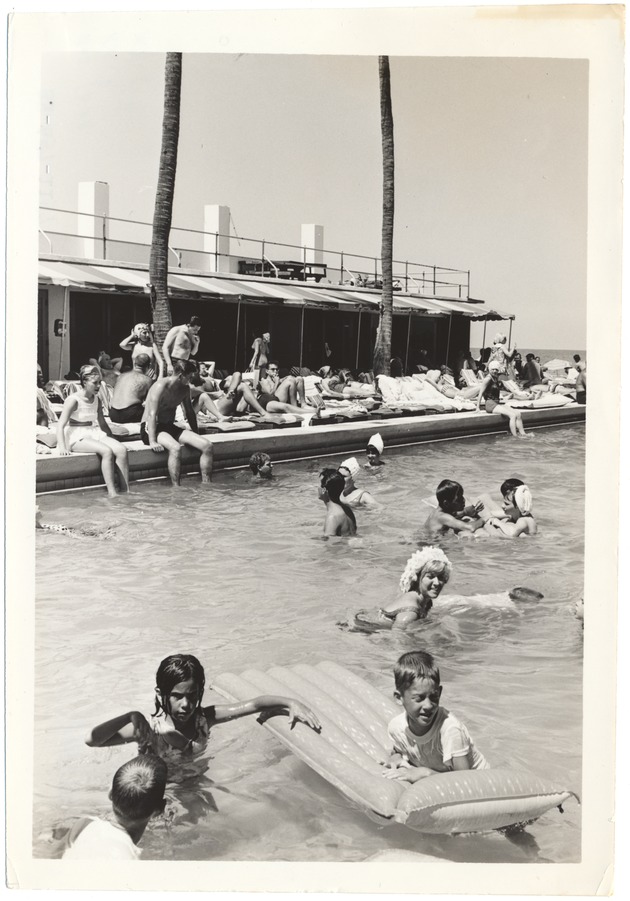 Miami Beach promotional hotel pool scenes - Photograph, recto: [Children and adults swimming in a hotel pool].