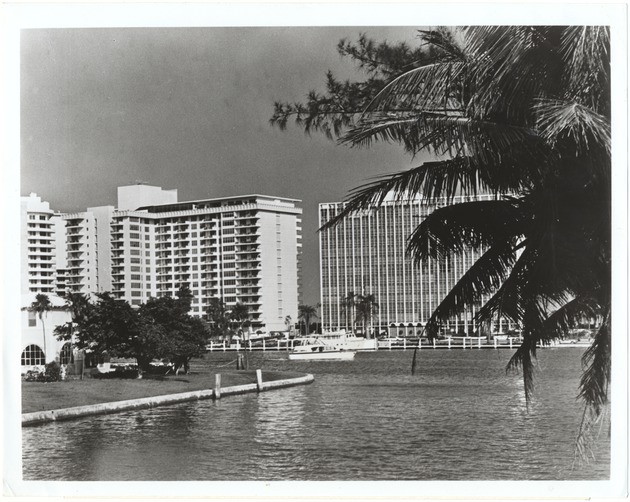 Scene of Large Buildings with Docked Boats by a Miami Beach Waterway - 