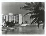 Scene of Large Buildings with Docked Boats by a Miami Beach Waterway