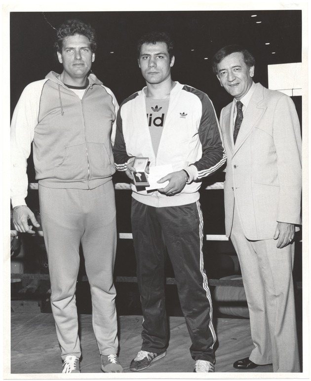 Miami Beach mayors and commissioners at various events - Photograph, recto: [Weigh-in at Convention Center (left to right) Commissioner Alex Daoud, Lucien Rodriguez, Mayor Murray Meyerson]