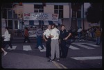 Police officers standing on street