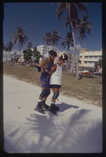 Man and woman rollerblading