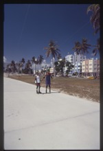 Two rollerbladers at park