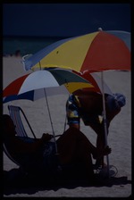 Man puts up umbrella