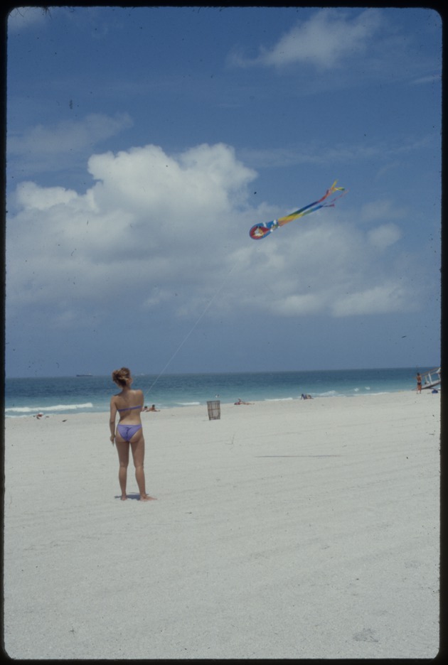 Woman flying kite