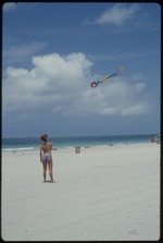 Woman flying kite