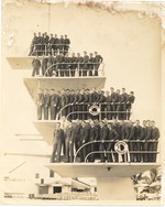 Posed portrait of young men/soldiers on diving board at the MacFadden Deauville Hotel