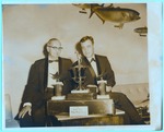 Men in front of the Walter Huhn Blue Marlin Trophy