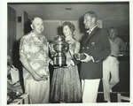 People posing with trophy