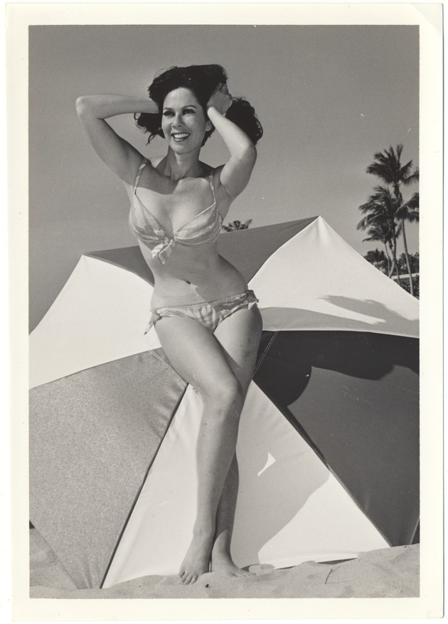 Lynn Allison styling next to an umbrella - 