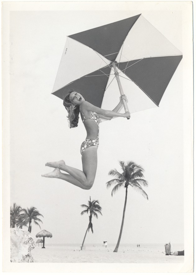 Dominique Doherty jumping with an umbrella - 