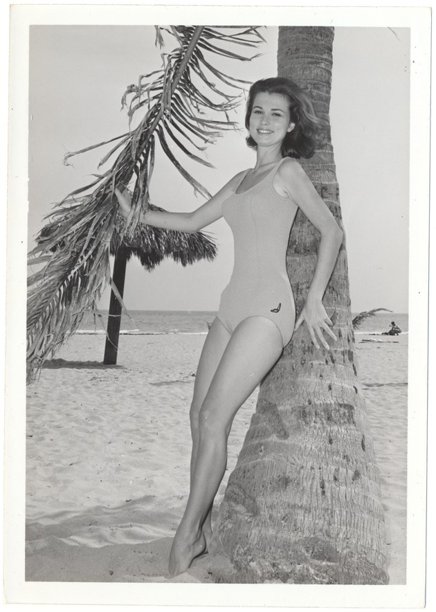Helen Grossman holding a palm tree's leaf - 
