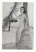Helen Grossman holding a palm tree's leaf
