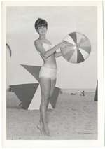 Pat Thomas holding a beach ball