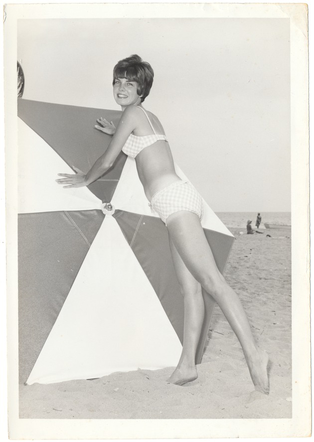 Pat Thomas pushing an umbrella - 