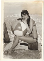Coni Ensor hugs a beach ball
