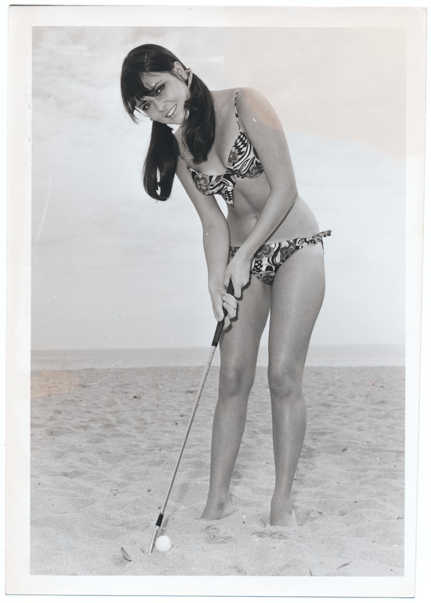 Coni Ensor golfing on the beach - 