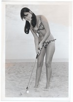 Coni Ensor golfing on the beach