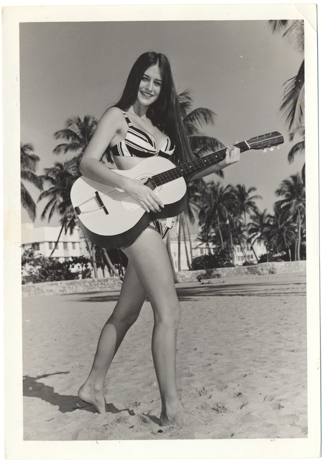 Arlette Frankenfield playing a guitar - 