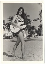 Arlette Frankenfield playing a guitar
