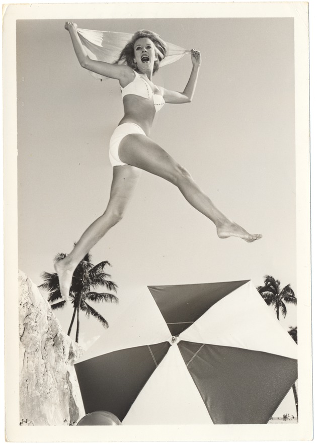 Cynthia Williams jumping with a scarf in over an umbrella - 