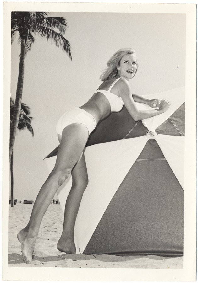 Cynthia Williams laying on an umbrella - 