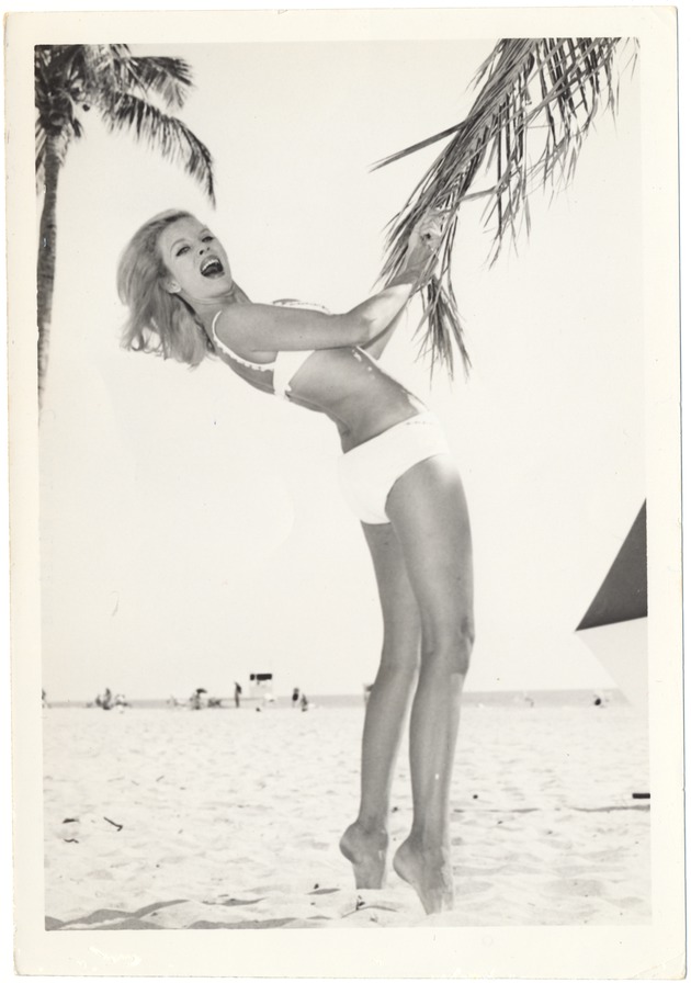 Cynthia Williams grabing a palm tree leaf - 