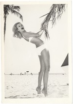 Cynthia Williams grabing a palm tree leaf
