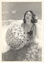 Adrienne Bourbeau playing with a beach ball in the water