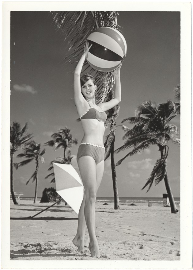 Melinda Brady with a beach ball over her head - 