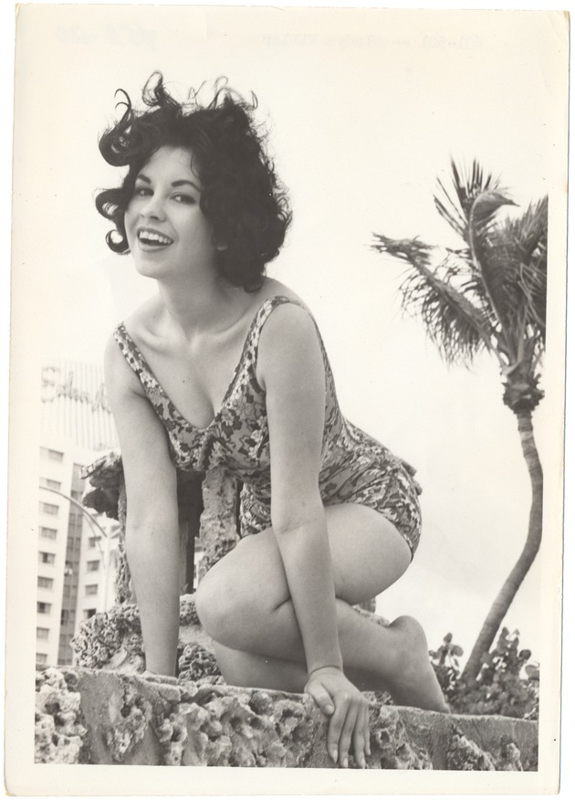 Gladys Villar scaling a coral rock wall - 