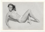 Elaine Richards laying on the sand