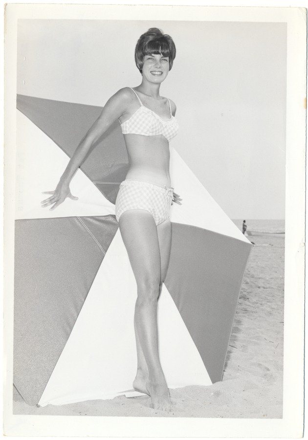Pat Thomas with an umbrella in the background - 