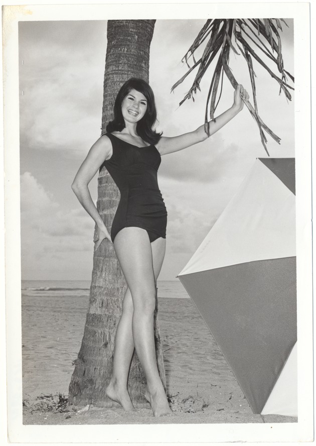 Priscilla Hairston with a palm tree and an umbrella - 
