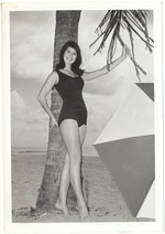 Priscilla Hairston with a palm tree and an umbrella