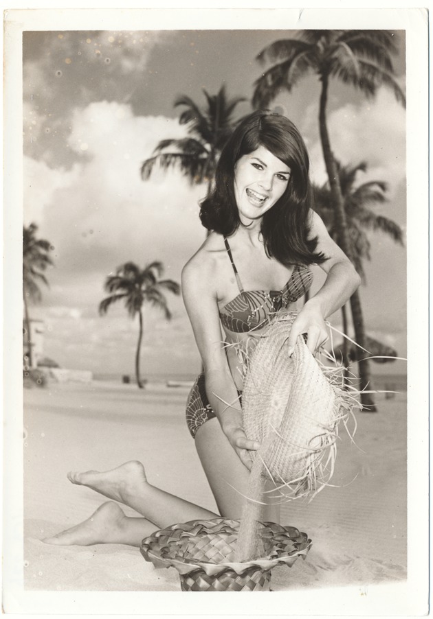 Priscilla Hairston pouring sand from one hat to another - 