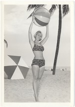 Diane Edney with a beach ball and an umbrella