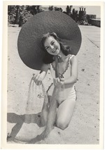 Dottie Rawlings wearing a hat and playing with the sand