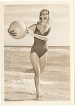 Lanita Kent running with a beach ball